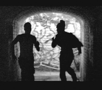boys run through tunnel